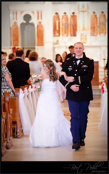 Miranda & Adam walking down the isle wedding photo