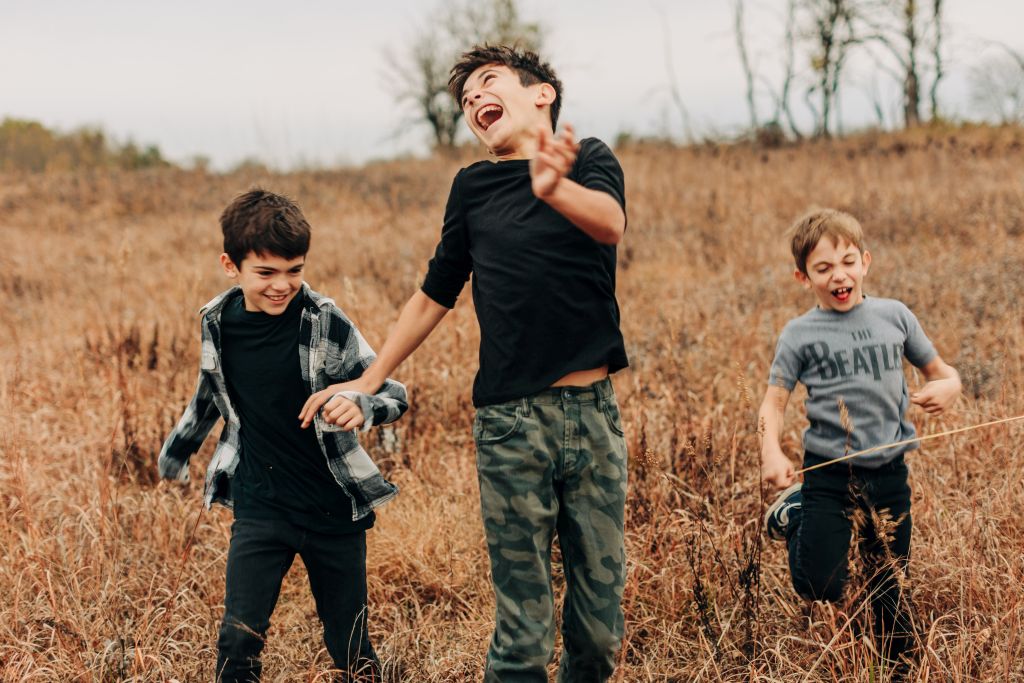 three boys going wild and enjoying their own company in front of the camera in Harrison Arkansas