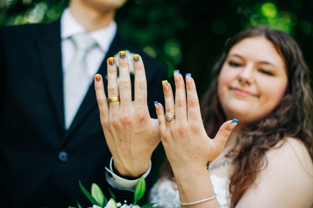 newlyweds show off their painted fingernails in Harrison AR